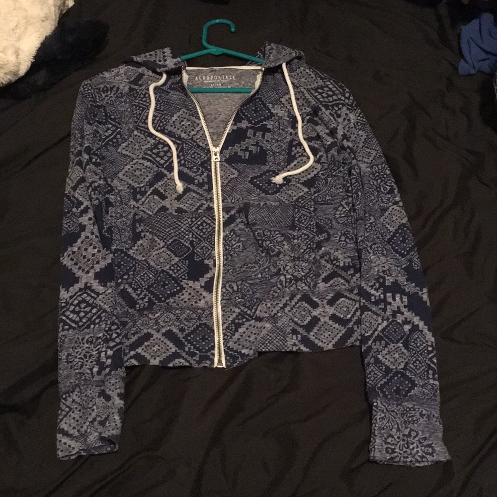 Zip up jacket with hood.
